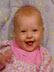 Smiling in the bouncy chair.